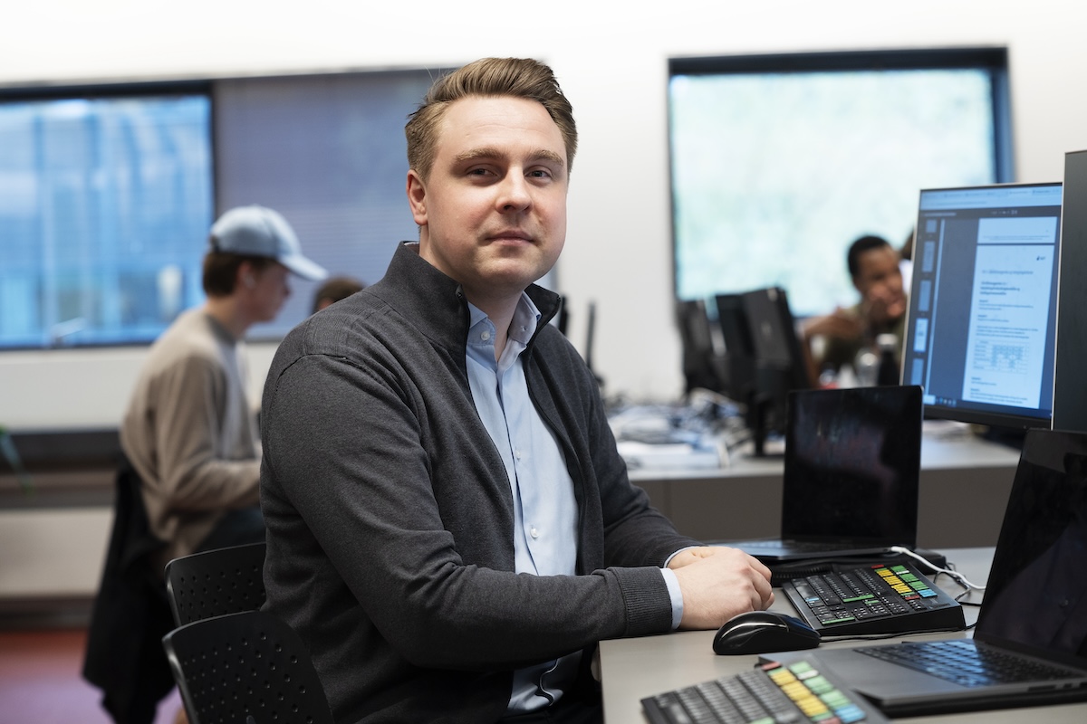 A person sitting in front of a computer